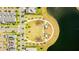 Aerial view of a community green space and walkway by the lake with a peaceful and accessible recreation area at 11479 Satire St, Orlando, FL 32832