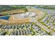 Community aerial view showcasing the proximity to a local school, green spaces, and the neighborhood layout at 11479 Satire St, Orlando, FL 32832