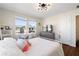 Sunlit bedroom featuring a bed, shelving, and a stylish desk, creating a peaceful and functional area at 11479 Satire St, Orlando, FL 32832