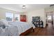 Bright bedroom with hardwood floors, natural light, and closet access at 11479 Satire St, Orlando, FL 32832