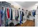 Walk-in closet with built-in shelving, ample storage space, and organized hanging racks at 11479 Satire St, Orlando, FL 32832