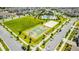 Aerial view of a community with playground, pool, clubhouse, and basketball court at 11479 Satire St, Orlando, FL 32832
