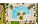 Aerial view of community pool with lounge chairs providing a relaxing atmosphere for residents at 11479 Satire St, Orlando, FL 32832