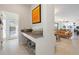 Functional entryway with counter space, shoe storage, and a view into the living room, blending style and organization at 11479 Satire St, Orlando, FL 32832