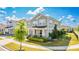 Beautiful exterior view of a two-story home with a manicured lawn and established landscaping at 11479 Satire St, Orlando, FL 32832