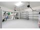 Spacious three car garage featuring ample storage, organization systems, and room for vehicles and equipment at 11479 Satire St, Orlando, FL 32832