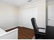 This office area has a desk, chair, hardwood flooring, and a closet, creating a quiet workspace at 11479 Satire St, Orlando, FL 32832