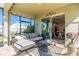 Covered patio offering comfortable seating and a view of the manicured backyard, perfect for outdoor relaxation and entertainment at 11479 Satire St, Orlando, FL 32832