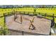 A close up of playground featuring climbing net and benches at 11479 Satire St, Orlando, FL 32832