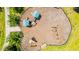 Aerial view of the community playground with swings and play structures, perfect for families at 11479 Satire St, Orlando, FL 32832