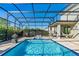 Inviting screened-in pool area featuring a sparkling pool, fountain, outdoor seating, and a relaxing hammock at 11479 Satire St, Orlando, FL 32832