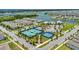 Aerial view of the community amenities, including a pool, tennis courts, and lush landscaping at 14335 Sapelo Beach Dr, Orlando, FL 32827