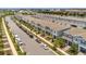 Aerial view of the townhomes and community showcasing the well-manicured lawns and proximity to parking at 14335 Sapelo Beach Dr, Orlando, FL 32827