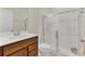 Bright bathroom with a vanity with countertop, toilet, and glass enclosed shower stall at 14335 Sapelo Beach Dr, Orlando, FL 32827
