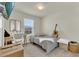Cozy bedroom featuring a neutral color palette, window and décor at 14335 Sapelo Beach Dr, Orlando, FL 32827