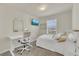 Bright bedroom featuring a window, TV and desk at 14335 Sapelo Beach Dr, Orlando, FL 32827