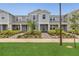 Charming townhouse featuring a well-manicured lawn and inviting entrance at 14335 Sapelo Beach Dr, Orlando, FL 32827