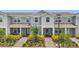 Charming townhome featuring a meticulously landscaped front yard and inviting entrance at 14335 Sapelo Beach Dr, Orlando, FL 32827