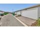 Row of garages showcasing white doors and paved driveways at 14335 Sapelo Beach Dr, Orlando, FL 32827