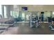 Well-equipped community gym with treadmills, weights, and a mirrored wall at 14335 Sapelo Beach Dr, Orlando, FL 32827
