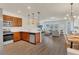Open-concept kitchen flowing into the living room and dining area with stainless steel appliances at 14335 Sapelo Beach Dr, Orlando, FL 32827