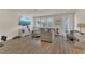 Bright living room with modern sectional sofa and natural light from large windows at 14335 Sapelo Beach Dr, Orlando, FL 32827