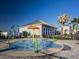 Community splash pad for children with sprayers and green poles, a perfect summer activity at 14335 Sapelo Beach Dr, Orlando, FL 32827