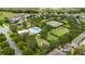 Aerial view of neighborhood amenities featuring a pool, tennis courts, and playground at 15693 Kinnow Mandarin Ln, Winter Garden, FL 34787