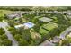 Aerial view of community amenities featuring a pool, tennis courts, and playground at 15693 Kinnow Mandarin Ln, Winter Garden, FL 34787