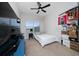 Bedroom featuring a TV, a window, and a ceiling fan at 15693 Kinnow Mandarin Ln, Winter Garden, FL 34787