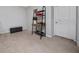 Bedroom with neutral walls, carpet floors, and a modern shelf desk by the door at 15693 Kinnow Mandarin Ln, Winter Garden, FL 34787