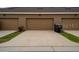 Three-car garage with ample parking space at 15693 Kinnow Mandarin Ln, Winter Garden, FL 34787
