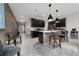 Spacious kitchen with dark cabinetry, a kitchen island with chairs, and stainless appliances at 15693 Kinnow Mandarin Ln, Winter Garden, FL 34787