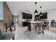 Open-concept kitchen with dark cabinets, stainless steel appliances, and a center island at 15693 Kinnow Mandarin Ln, Winter Garden, FL 34787
