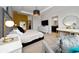 Primary bedroom features a tray ceiling, a TV, a makeup table, and decor at 15693 Kinnow Mandarin Ln, Winter Garden, FL 34787