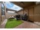 Cozy patio with artificial grass, seating, and barbecue grill, ideal for outdoor dining at 15693 Kinnow Mandarin Ln, Winter Garden, FL 34787