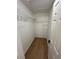 Walk-in closet with wire shelving and laminate wood floor at 1639 Corner Meadow Cir, Orlando, FL 32820