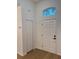 Welcoming entryway with natural light and a classic front door design at 1639 Corner Meadow Cir, Orlando, FL 32820