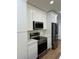Kitchen with stainless steel appliances, and white cabinets at 1639 Corner Meadow Cir, Orlando, FL 32820