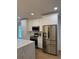 Gourmet kitchen featuring stainless steel appliances, and sleek white cabinetry at 1639 Corner Meadow Cir, Orlando, FL 32820