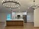 Beautiful kitchen with stainless steel appliances, modern lighting, and center island at 1639 Corner Meadow Cir, Orlando, FL 32820