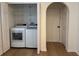 Convenient laundry room with modern washer and dryer, and ample shelving at 1639 Corner Meadow Cir, Orlando, FL 32820