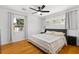 Inviting bedroom features hardwood floors, neutral walls and a ceiling fan at 2072 Grandview S Ave, Sanford, FL 32771