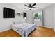 Bright bedroom with ceiling fan and light hardwood floors offers a comfortable and stylish space at 2072 Grandview S Ave, Sanford, FL 32771