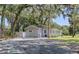 Exterior of home with mature landscaping and driveway at 2072 Grandview S Ave, Sanford, FL 32771