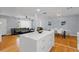 Spacious open-concept living area with stainless steel appliances, modern lighting, and a large island at 2072 Grandview S Ave, Sanford, FL 32771
