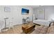 Versatile living room featuring a desk, sleeper sofa, and TV at 2072 Grandview S Ave, Sanford, FL 32771