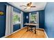 Cozy home office with natural light, hardwood floors, a ceiling fan, and a workspace at 2072 Grandview S Ave, Sanford, FL 32771