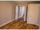 A spare bedroom with wood flooring, leading to other rooms at 2181 Wekiwa Oaks Dr, Apopka, FL 32703