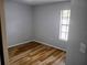 Comfortable bedroom featuring stylish floors and a bright window at 2181 Wekiwa Oaks Dr, Apopka, FL 32703